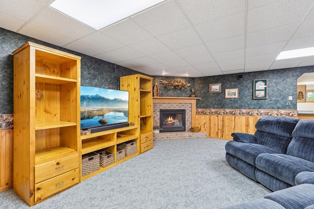4765 344th Ln NW, Cambridge, MN 55008 - living area featuring a drop ceiling, carpet, wainscoting, a fireplace, and wood walls