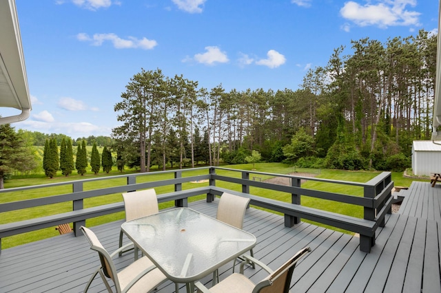 4765 344th Ln NW, Cambridge, MN 55008 - deck with outdoor dining space, a yard, and view of scattered trees