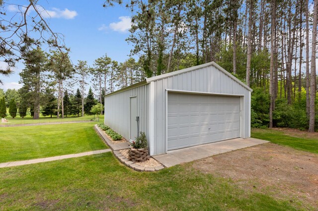 4765 344th Ln NW, Cambridge, MN 55008 - detached garage featuring view of wooded area