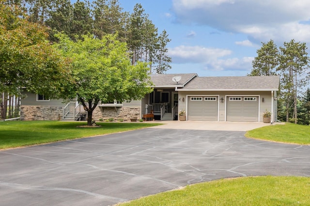 4765 344th Ln NW, Cambridge, MN 55008 - view of front facade with asphalt driveway, an attached garage, stone siding, and a front yard