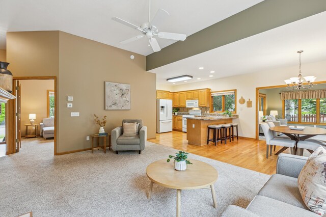 307 Lincoln Dr SE, Saint Michael, MN 55376 - living area featuring a chandelier, ceiling fan, a high ceiling, baseboards, and recessed lighting