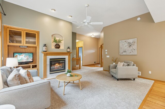 307 Lincoln Dr SE, Saint Michael, MN 55376 - living area featuring a glass covered fireplace, a ceiling fan, baseboards, wood finished floors, and recessed lighting