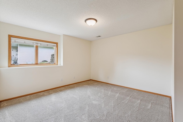 307 Lincoln Dr SE, Saint Michael, MN 55376 - carpeted spare room with baseboards and a textured ceiling