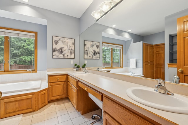 307 Lincoln Dr SE, Saint Michael, MN 55376 - bathroom with a bath, tile patterned floors, plenty of natural light, double vanity, and recessed lighting