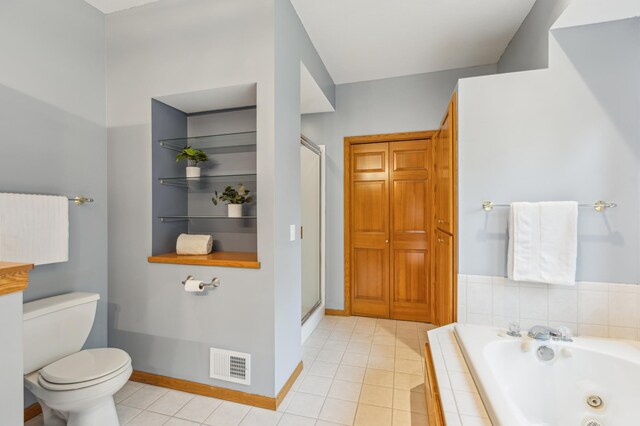307 Lincoln Dr SE, Saint Michael, MN 55376 - bathroom with toilet, a jetted tub, baseboards, a shower stall, and tile patterned floors