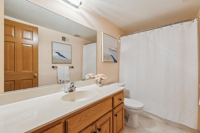 307 Lincoln Dr SE, Saint Michael, MN 55376 - bathroom with toilet, vanity, a textured ceiling, and tile patterned flooring