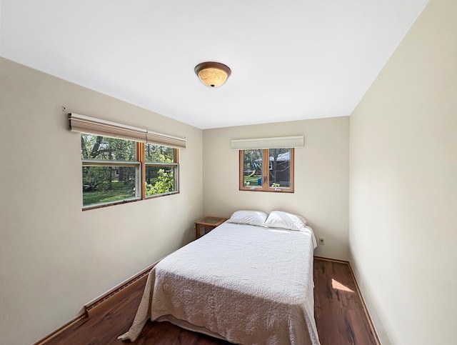 602 26th St, Scanlon, MN 55720 - bedroom with wood finished floors and baseboards