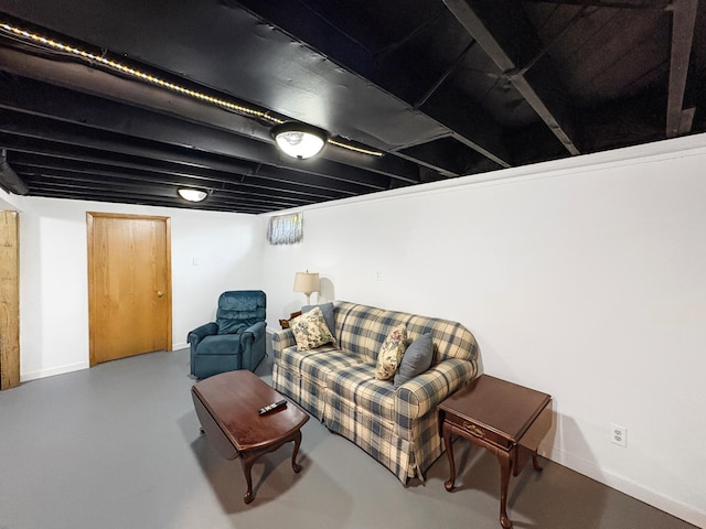 602 26th St, Scanlon, MN 55720 - living area with concrete flooring and baseboards