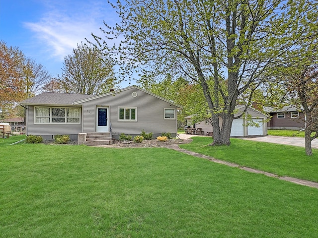 602 26th St, Scanlon, MN 55720 - ranch-style house with a front yard, an outdoor structure, driveway, and a garage