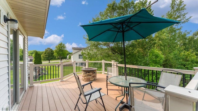13590 Jesse St, Becker, MN 55308 - wooden terrace with a fire pit and outdoor dining area