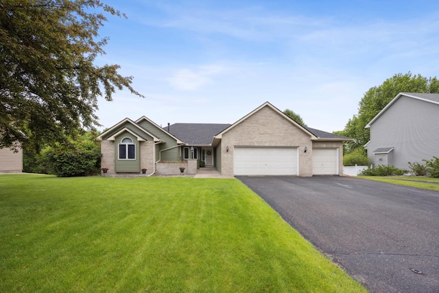 582 139th Ln NW, Andover, MN 55304 - ranch-style home with a garage, asphalt driveway, a front yard, brick siding, and roof with shingles