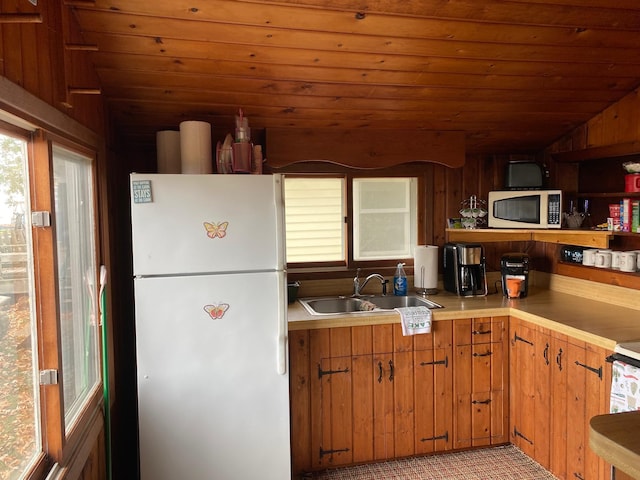 42606 Pleasure Park Rd, Otter Tail Twp, MN 56571 - kitchen featuring white appliances, lofted ceiling, a sink, healthy amount of natural light, and wood ceiling
