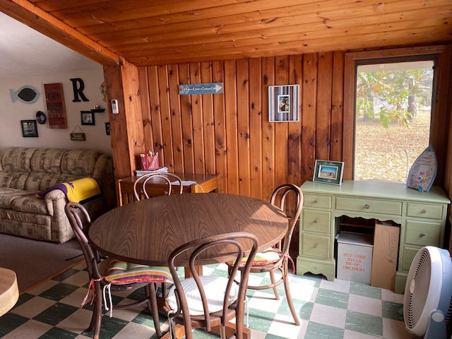 42606 Pleasure Park Rd, Otter Tail Twp, MN 56571 - dining room featuring tile patterned floors, wooden ceiling, and wood walls