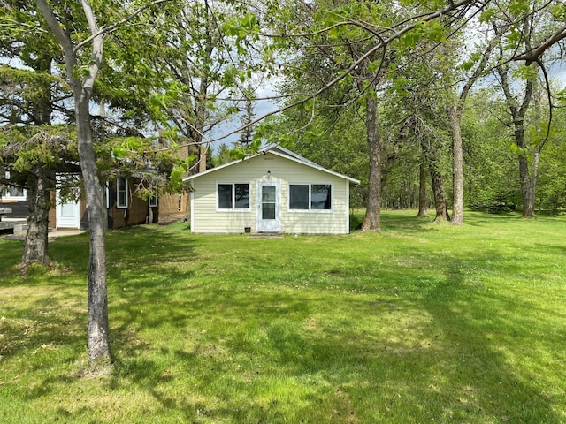 42606 Pleasure Park Rd, Otter Tail Twp, MN 56571 - rear view of property with a lawn