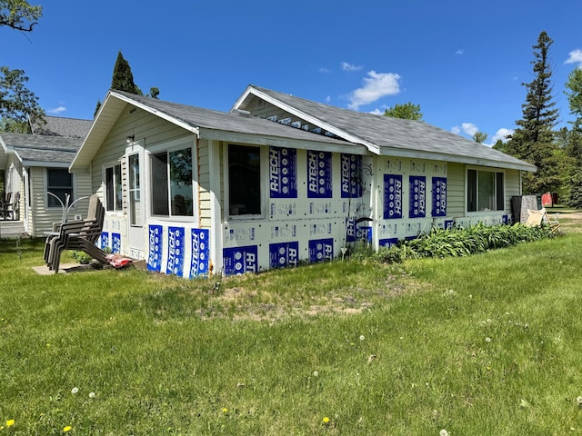 42606 Pleasure Park Rd, Otter Tail Twp, MN 56571 - view of side of property featuring a lawn