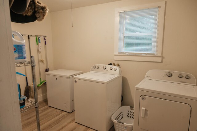 835 Park St, Fairmont, MN 56031 - laundry area featuring separate washer and dryer and light wood finished floors