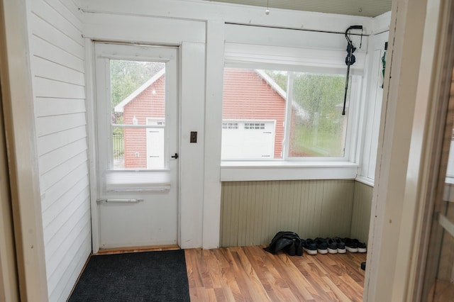 835 Park St, Fairmont, MN 56031 - doorway featuring wood finished floors and wooden walls