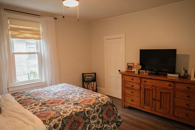 835 Park St, Fairmont, MN 56031 - bedroom with dark wood finished floors and crown molding