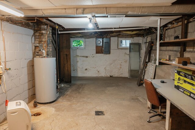 835 Park St, Fairmont, MN 56031 - basement featuring water heater, electric panel, and healthy amount of natural light