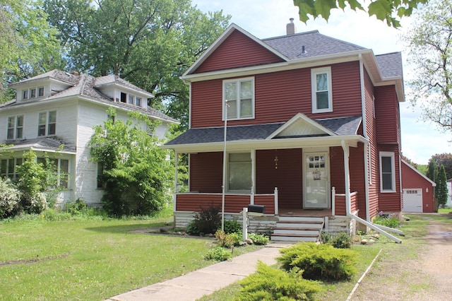 835 Park St, Fairmont, MN 56031 - traditional style home with roof with shingles, a porch, a front lawn, and a chimney