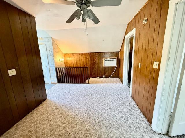 220 Front St E, Redwood Falls, MN 56283 - bonus room featuring wooden walls, light carpet, lofted ceiling, a wall mounted AC, and ceiling fan