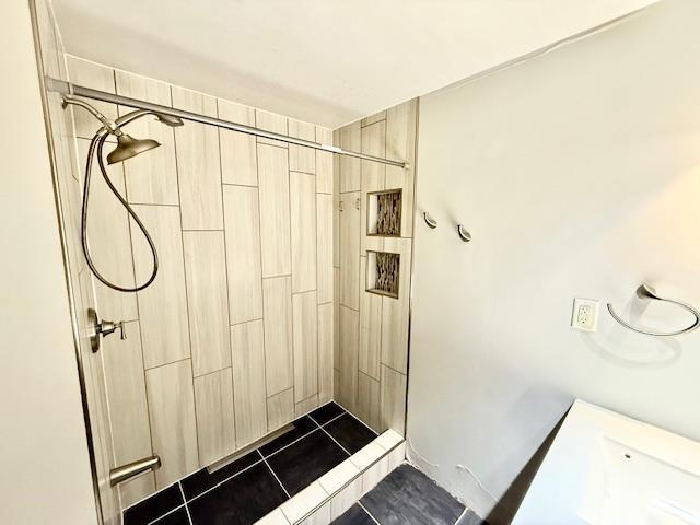 220 Front St E, Redwood Falls, MN 56283 - full bath featuring a tile shower and tile patterned flooring
