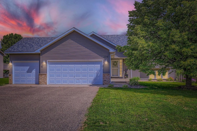 220 Maverick Ave, Elko New Market, MN 55054 - ranch-style home featuring a front yard, asphalt driveway, a garage, and a shingled roof