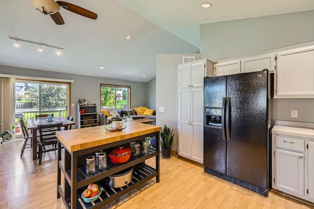 220 Maverick Ave, Elko New Market, MN 55054 - kitchen with black fridge with ice dispenser, white cabinets, wood counters, light wood-style flooring, and ceiling fan