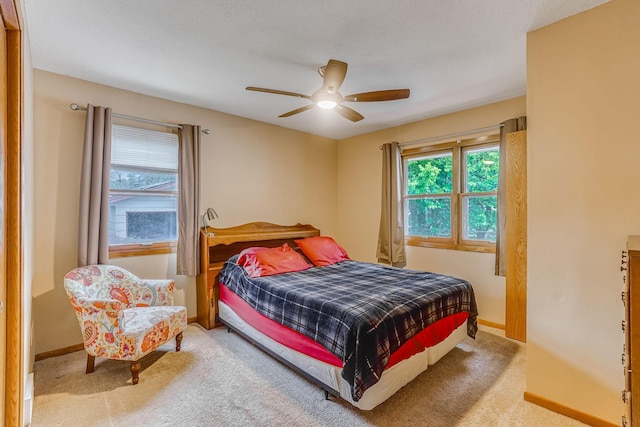 1221 43rd Ave NE, Columbia Heights, MN 55421 - carpeted bedroom featuring baseboards and ceiling fan