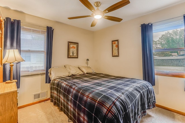 1221 43rd Ave NE, Columbia Heights, MN 55421 - bedroom with carpet floors, baseboards, and a ceiling fan
