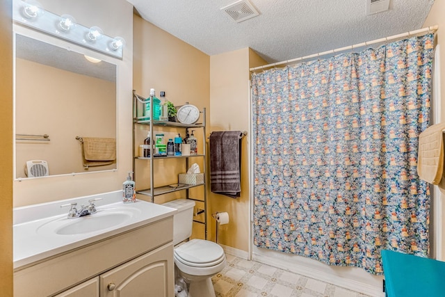 1221 43rd Ave NE, Columbia Heights, MN 55421 - full bathroom featuring vanity, toilet, a textured ceiling, tile patterned floors, and shower / tub combo