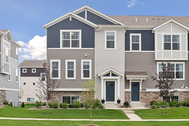 6678 Wildflower Way, Minnetrista, MN 55331 - view of front of property with entry steps, stone siding, and a front yard