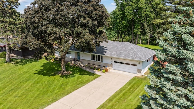 5456 Twin Lake Blvd E, Brooklyn Center, MN 55429 - view of front facade with a front yard, a garage, driveway, and a shingled roof