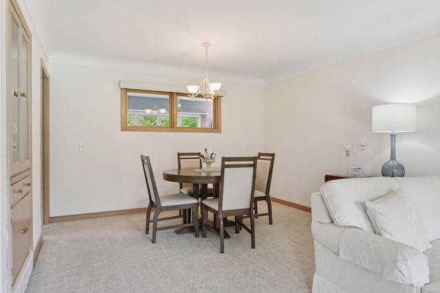 5456 Twin Lake Blvd E, Brooklyn Center, MN 55429 - dining room featuring a chandelier and light carpet