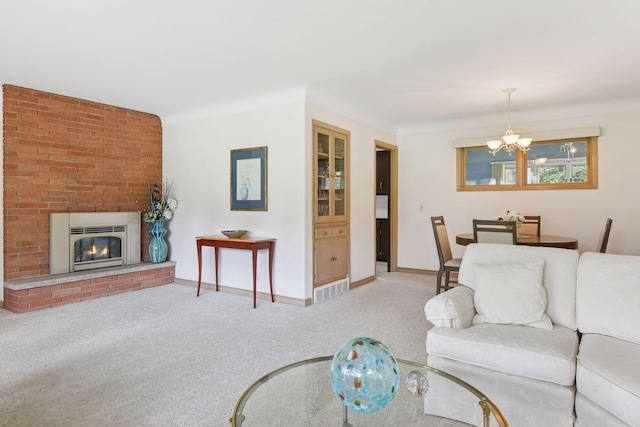 5456 Twin Lake Blvd E, Brooklyn Center, MN 55429 - living room with a chandelier, carpet flooring, and a fireplace
