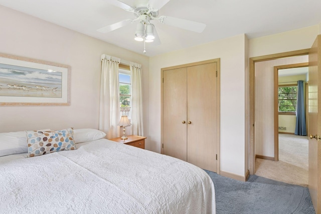 5456 Twin Lake Blvd E, Brooklyn Center, MN 55429 - carpeted bedroom with multiple windows, a closet, and ceiling fan