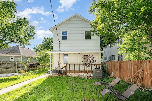 4037 42nd Ave S, Minneapolis, MN 55406 - rear view of house featuring central AC unit, a trampoline, and a wooden deck