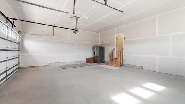 1969 Lusitano St, Shakopee, MN 55379 - garage featuring stainless steel refrigerator with ice dispenser and a garage door opener