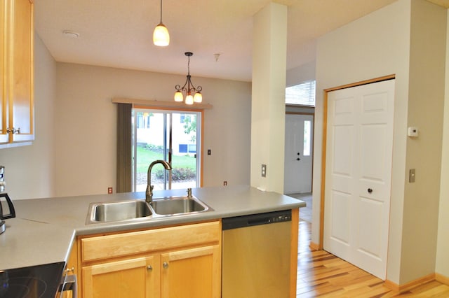 9452 Marshall Rd, Eden Prairie, MN 55347 - kitchen with dishwasher, a sink, light wood-style floors, hanging light fixtures, and light countertops