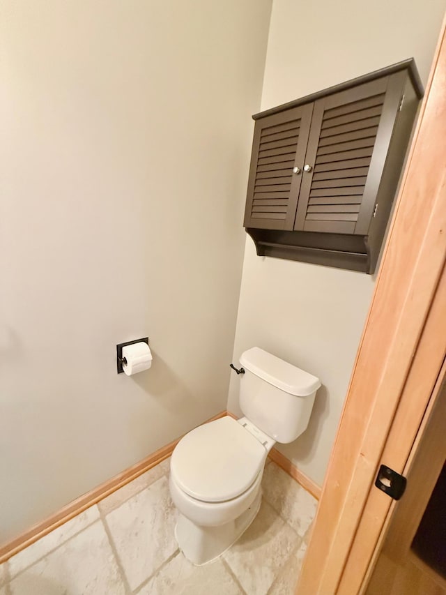 9452 Marshall Rd, Eden Prairie, MN 55347 - bathroom with toilet, baseboards, and tile patterned floors