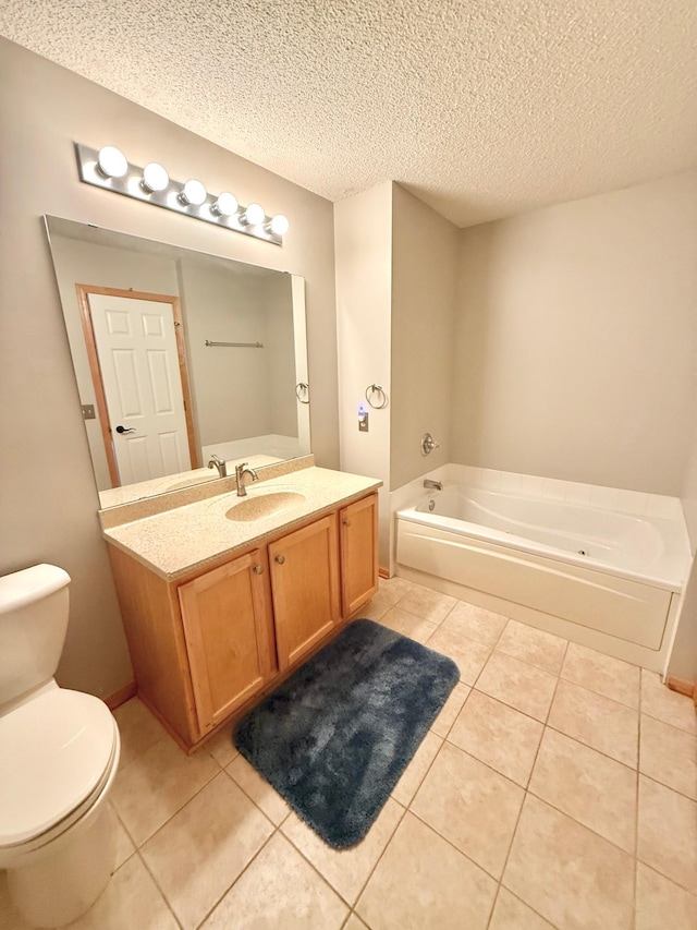9452 Marshall Rd, Eden Prairie, MN 55347 - full bathroom with a garden tub, toilet, vanity, a textured ceiling, and tile patterned floors