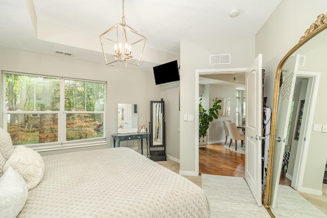 4132 Vernon Ave S Unit A101, Saint Louis Park, MN 55416 - bedroom with light carpet, a chandelier, and baseboards