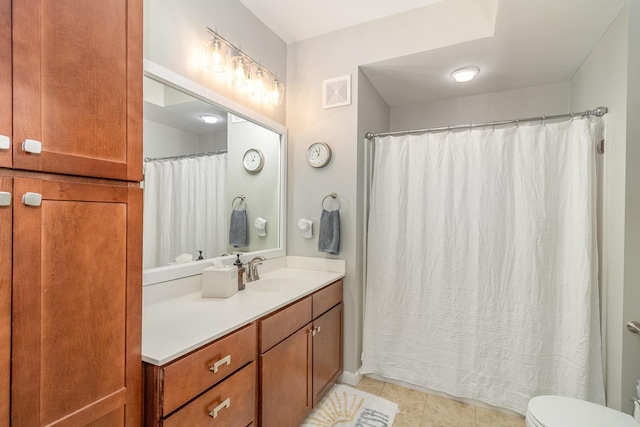 4132 Vernon Ave S Unit A101, Saint Louis Park, MN 55416 - bathroom with vanity, toilet, tile patterned floors, and a shower with curtain