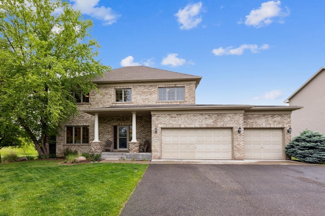 13910 47th Ln NE, Saint Michael, MN 55376 - view of front of house with brick siding, a front lawn, asphalt driveway, and a garage
