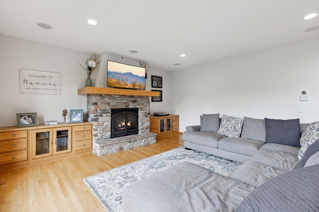 13910 47th Ln NE, Saint Michael, MN 55376 - living room featuring wood finished floors, a stone fireplace, and recessed lighting