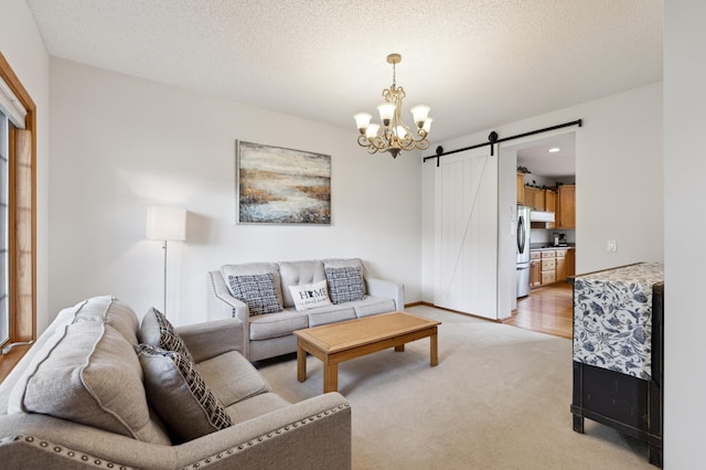 13910 47th Ln NE, Saint Michael, MN 55376 - living area featuring a chandelier, a barn door, and light colored carpet