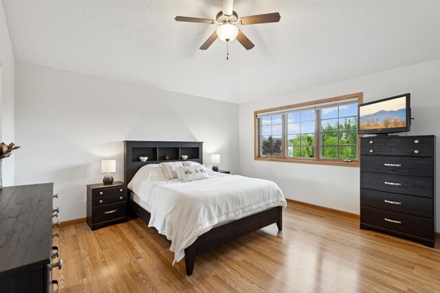 13910 47th Ln NE, Saint Michael, MN 55376 - bedroom with baseboards, light wood-style floors, lofted ceiling, and ceiling fan