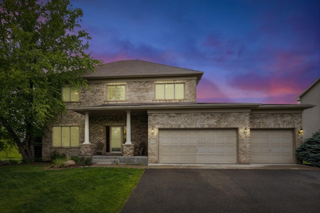 13910 47th Ln NE, Saint Michael, MN 55376 - traditional-style home featuring brick siding, driveway, a front yard, and an attached garage