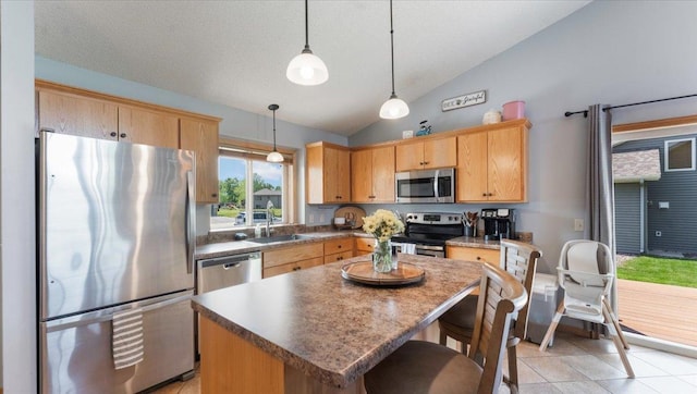24405 18th Ave, Saint Augusta, MN 56301 - kitchen with stainless steel appliances, a sink, a center island, pendant lighting, and a kitchen bar