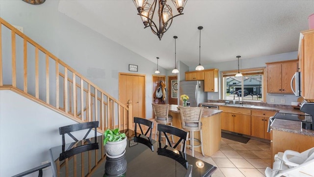 24405 18th Ave, Saint Augusta, MN 56301 - kitchen featuring appliances with stainless steel finishes, a sink, hanging light fixtures, a chandelier, and light tile patterned floors